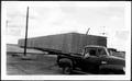 Photograph: [Truck parked in front of a sulphur block]