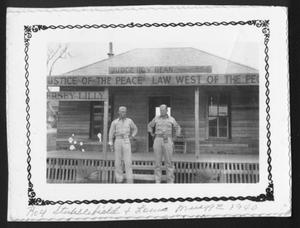 [Roy Stubblefield and Louis Muegge standing outside of a building]