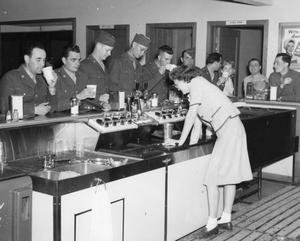 Primary view of object titled '[Soldiers at a Soda Fountain]'.