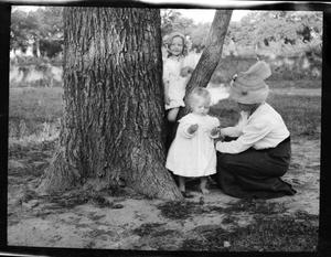 [Photograph of Children Playing by Tree]