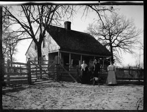 Primary view of object titled '[Photograph of Man and Two Women Standing in Corral]'.