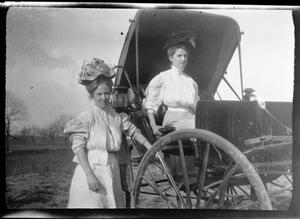 [Photograph of Two Women in Hats with Covered Buggy]