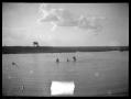 Photograph: [Photograph of People Swimming in Water Hole]