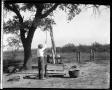 Primary view of [Photograph of Boy Pulling Up Object with Pulley System]
