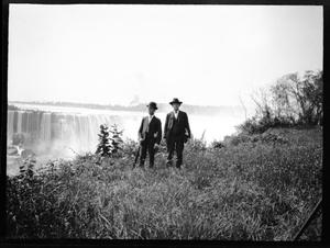 [Two Men and a Waterfall]