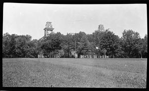 [Photograph of Large Building Beyond Trees]