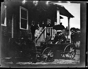 [Photograph of Group on Stairs Leading to Wagon]