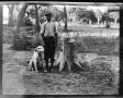 Thumbnail image of item number 1 in: '[Photograph of Boy with Dog and Tree Stump]'.