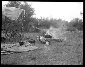 [Photograph of Elderly Man Making Camp]