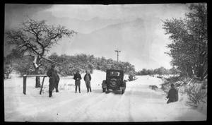 [Photograph of Evans Automobile on Snowy Path]