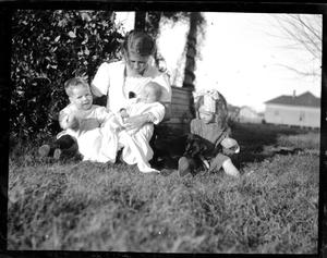 [Photograph of Young Woman with Three Children]