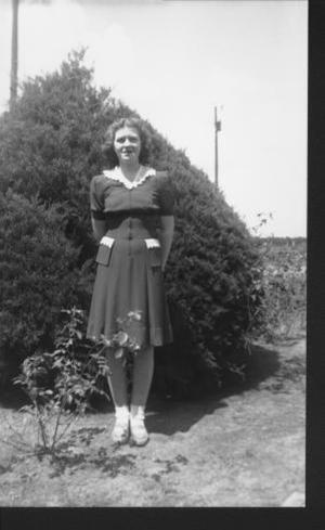 [Photograph of Madeline Jodarski in her yard on the George Ranch]