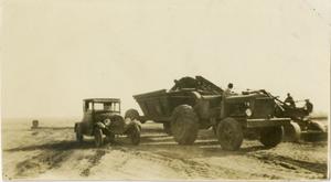Primary view of object titled '[Car Beside Tractor]'.