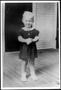 Photograph: [Joyce Kopycinski as a little girl, standing on a porch]