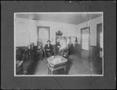 Photograph: [People in the interior of a barber shop]
