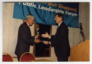 [Photograph of Dr. Charles A. LeMaistre Receiving Award]