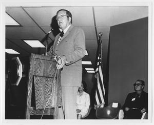[Photograph of Governor Briscoe Behind Podium]
