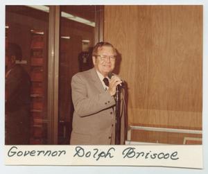 [Photograph of Governor Dolph Briscoe at Microphone]