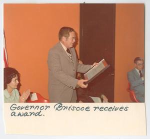 [Photograph of Governor Briscoe Receives Award]