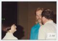 Photograph: [Photograph of Woman and Two Men at Conference]