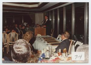 [Photograph of Richard Battle Speaking at Dinner Conference]