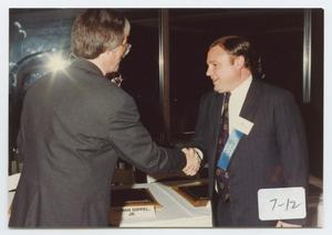 [Photograph of Dr. Perryman Shaking Hands]