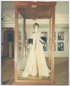 [Photograph of Mannequin Wearing Long Coat in Exhibit]