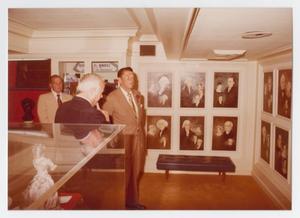 [Photograph of Ronald Reagan Looking at Presidential Portraits]