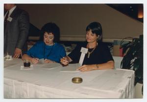 [Photograph of Gem Meacham and Others Signing Papers]