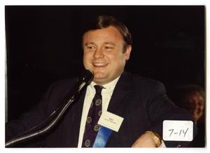 Primary view of object titled '[Photograph of Dr. Ray Perryman At Microphone]'.