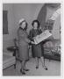 Photograph: [Photograph of  Lady Bird Johnson and a Woman Holding Documents]