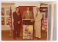 Photograph: [Photograph of Ronald Reagan Standing Behind Podium]