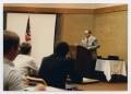 Thumbnail image of item number 1 in: '[Photograph of Dr. Duane M. Leach at Podium]'.