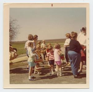Primary view of object titled '[Photograph of Children and Parents at Easter Egg Hunt]'.