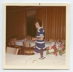 Primary view of object titled '[Photograph of Madge Daniel Admiring Decorations for Senior Banquet]'.