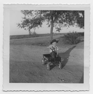 [Photograph of Robert Lee Daniel in Little Wagon]