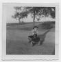Primary view of [Photograph of Robert Lee Daniel in Little Wagon]