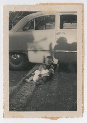 [Photograph of Robert Lee and Cynthia Daniel by Car]