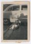 Photograph: [Photograph of Robert Lee and Cynthia Daniel by Car]