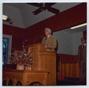 [Photograph of Mayor Jules Kappes at Church Podium]