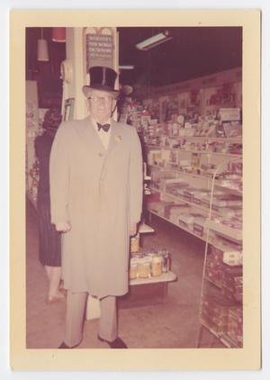 [Photograph of Mr. Turney Wearing Top-Hat in Store]