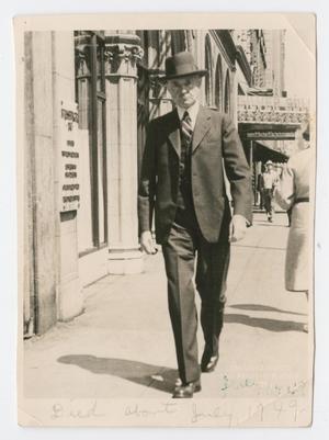 [Photograph of Dr. William King Walking Along Street]