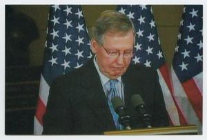 Primary view of object titled '[Mitch McConnell Speaking at a Podium]'.
