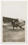 Photograph: [Woman Posing With Plane]