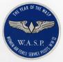 Text: [Blue Circular Sticker for the WASP]