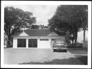 Primary view of object titled '[A car parked in front of George Ranch house garage]'.