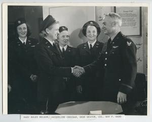 [Photograph of Jacqueline Cochran and Roy Ward Shaking Hands]