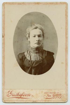 [Photograph of a Woman Wearing Dark Clothing]