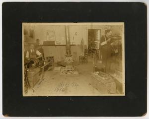 Primary view of [Photograph of Two Men in a Shoe Repair Store, 1916]