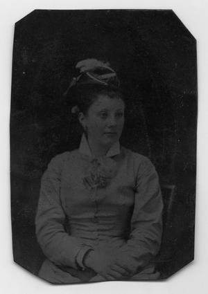 [Photograph of a Woman With Her Hands in Her Lap]